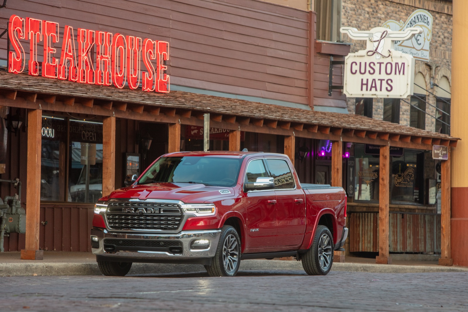 2025 Ram 1500 parked on a western storefront street.